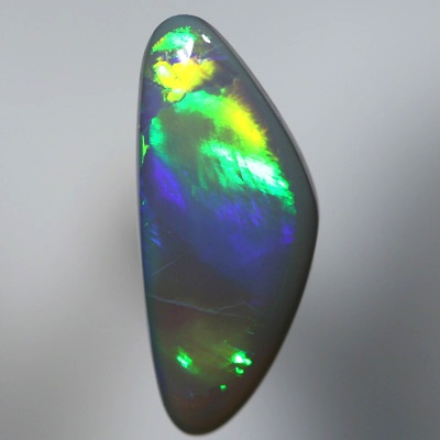 SOLID SEMI BLACK OPAL Large glassy rolling flashes, neon orange to green to purple